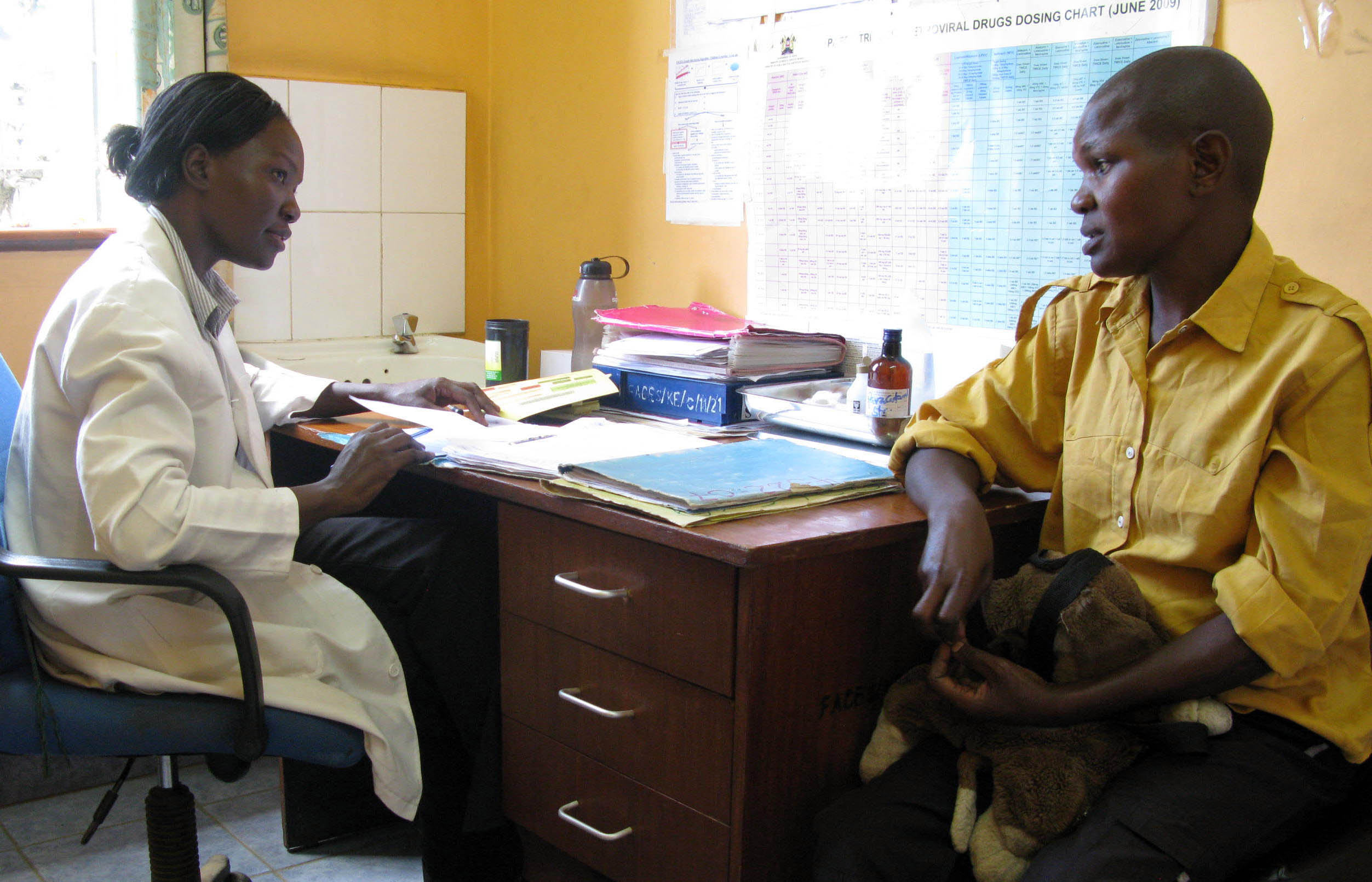 Photo of clinician and patient in consultation at FACES clinical site. Credit: Beth Novey